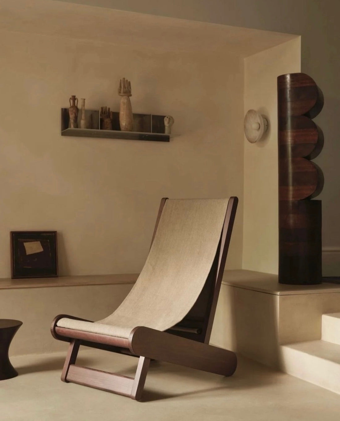Microcement wall with a chair and shelf